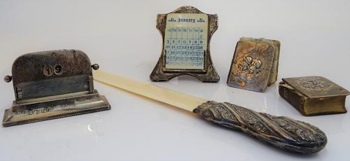 Silver and silver mounted wares, comprising; a Victorian page turner, the handle embossed with flowers and scrolls, London 1897, length 38cm, two...