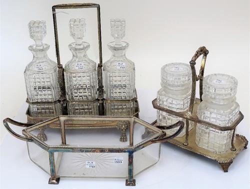 A group of silver plated, metal mounted glassware, comprising; a three bottle decanter stand, with hobnail cut decoration to the glassware, the stand...