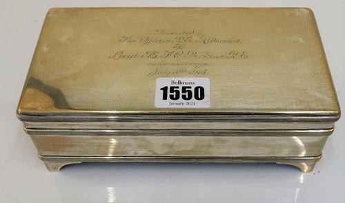 A rectangular silver cigarette box, Asprey, London 1914, with solid hinged cover, gilt lined, having threaded bands, on bracket feet, 18 x 9 x 6.7cm,...