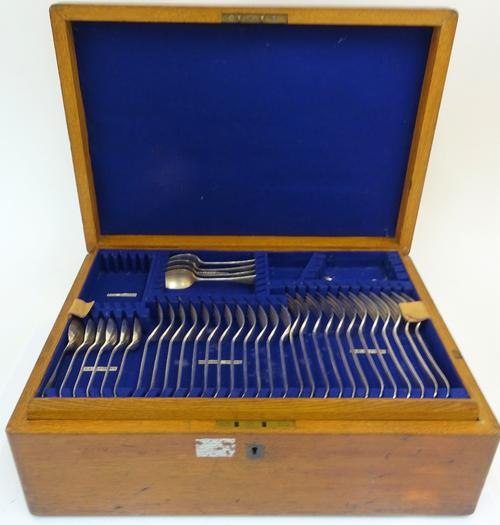 A plated Old English pattern part canteen of table flatware, comprising; twelve dessert spoons, six tablespoons, a soup ladle, a fish serving fork, a...