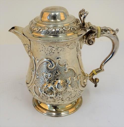 A Victorian silver pear shaped jug, Robert Hennell, London 1866, adapted from a mug, with additional marks for William Hutton & Sons, London 1894,...