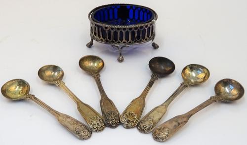 A George III oval silver salt cellar, Robert & David Hennell, London 1795, with pierced sides, on four claw and ball feet, 8.5cm wide, blue glass...