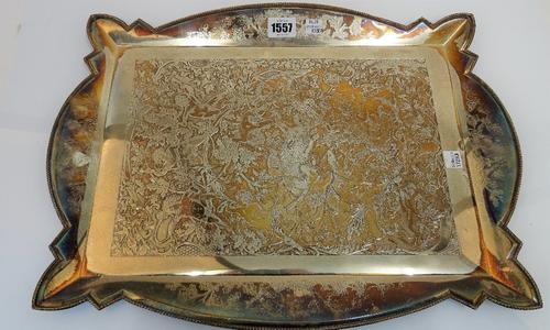 A silver plated shaped rectangular tray, the centre decorated with a wild boar hunting scene, with putto, size of tray 46cm x 33cm and a silver...