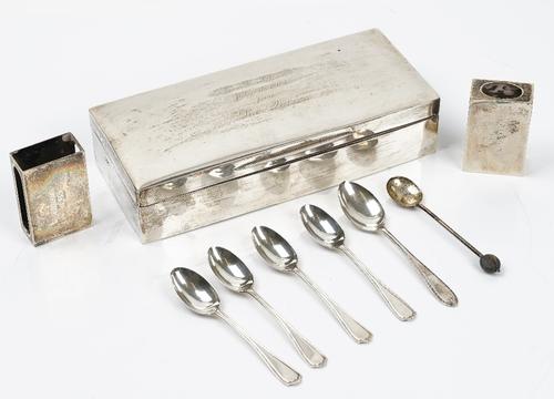 A rectangular silver cigarette box, Goldsmiths & Silversmiths Company, London 1914, 20.5 x 8.5 x 4.5cm, and two silver match box sleeves, all...