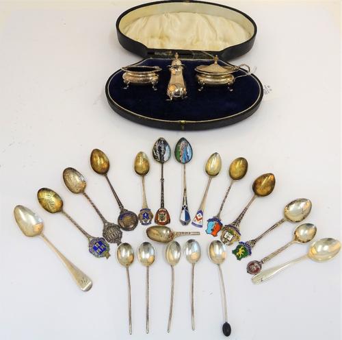 Silver and foreign wares, comprising; a cased three piece silver cruet set, Birmingham 1921, in fitted case, a collection of eleven silver souvenir...