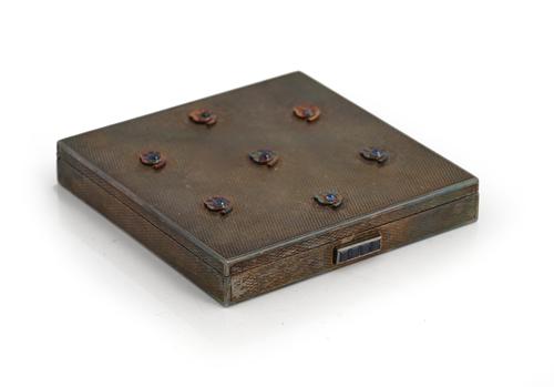 A French Mouboussin silver and sapphire set lady's square powder compact, the cover with seven cabochon sapphire set, stylized flower-shaped motifs,...