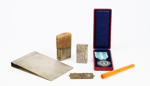 A silver rectangular notepad holder, with engine turned decoration, detailed 835 SF, weight 207gms, a Dunhill rectangular silver plated gas lighter...