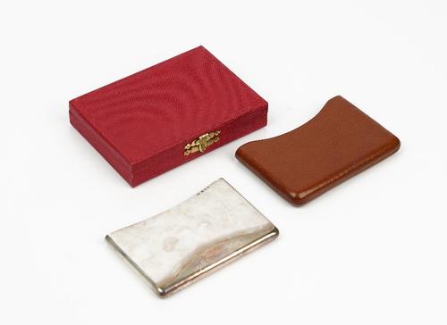 A Cartier London silver rectangular twin compartment case, of plain rectangular form, having a curved top, detailed J.C, London 1935, weight 114gms,...