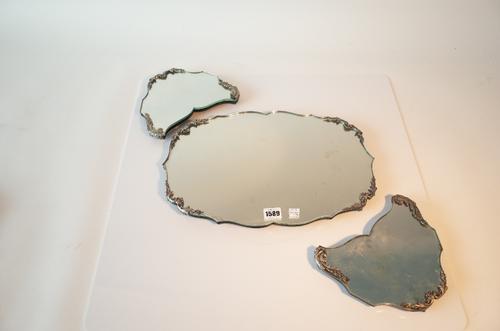 A foreign silver mounted table centre piece triple section mirror plateau, the cast mounts of foliate scroll and scalloped form, detailed 800...
