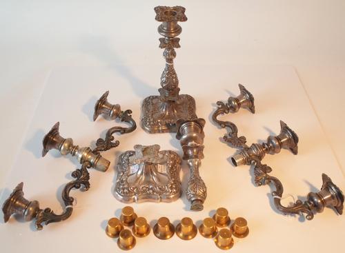 A pair of Austrian three light table candelabra, each with scrolled decoration and alternative single candlestick fittings (one broken) all loaded,...