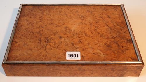 A French silver mounted rectangular burr walnut gaming box, the interior with compartments for two packs of playing cards (no playing cards present)...