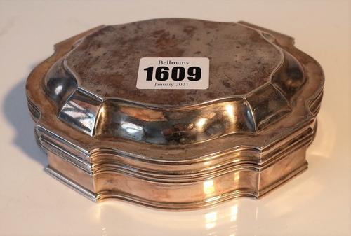 A French shaped oval hinge lidded box, gilt within, the exterior with ridged rims, length 13.7cm, weight 314 gms.