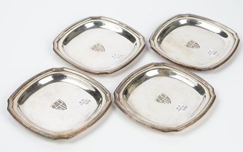 A set of four French silver plated dishes by Christofle, each of shaped square form, initial engraved to the centre, within a gadrooned rim, width...