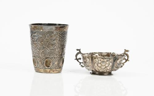 A beaker, probably Eastern European, second half of the 18th century, decorated with birds, flowers and scrolls, above a band of oval dished panels,...