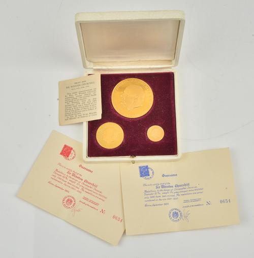 A set of three 18ct gold proof medallions commemorating Sir Winston Churchill, combined weight 70.6gms, with a display box.