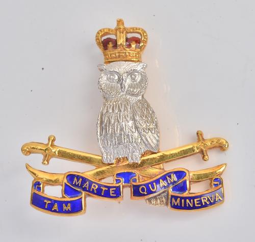 A 9ct two colour gold and enamelled Defence Services Staff College regimental brooch, by Garrard & Co, Birmingham 1964, 6.5gms, with a Garrard & Co....