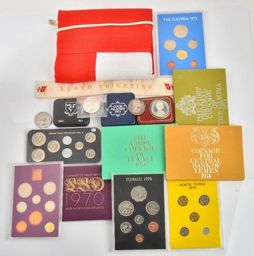 A collection of coins, comprising; An Isle of Man silver wedding anniversary twenty five pence 1972, cased, a Cook Islands two dollars 1973, cased,...