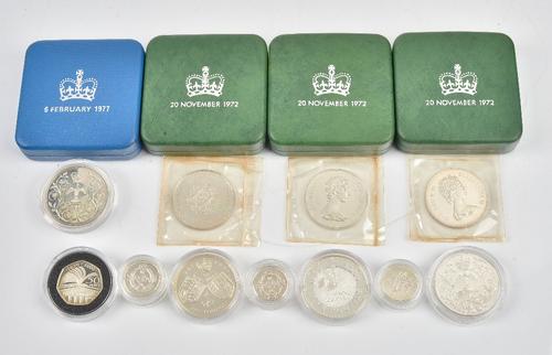 A group of British silver proof specimen coins, comprising; three 1972 crowns with cases a 1977 crown with a case, another 1977 crown, two five...