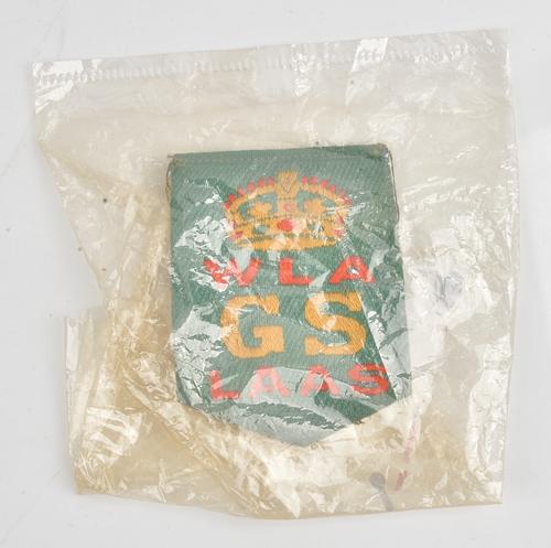 A First World War period Women's Land Army good service ribbon award badge, the back with safety pin fitting.