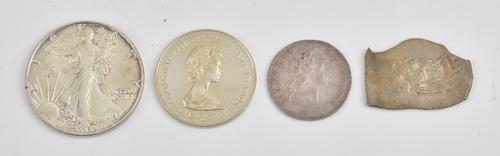 A French Louis XV Tresor Royal Jeton 1754, probably a copy of a cob coin, a USA one ounce fine silver one dollar 1988 and The Commonwealth of The...