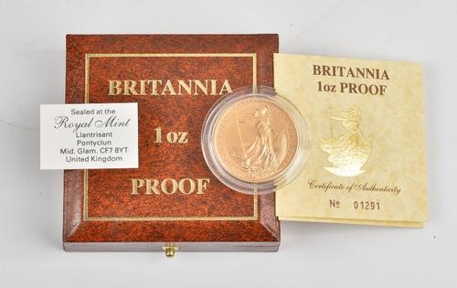 A Britannia one ounce gold one hundred pounds proof coin 1987, with a certificate of authenticity and Royal Mint case.