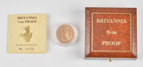 A Britannia one half of an ounce gold fifty pounds proof coin 1987, with a certificate of authenticity and Royal Mint case.