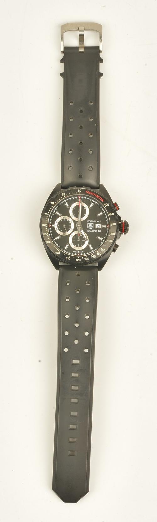 A gentleman's Tag Heuer Formula 1 Calibre 16 gentleman's chronograph wristwatch, the steel case coated in titanium carbide, the signed black dial...