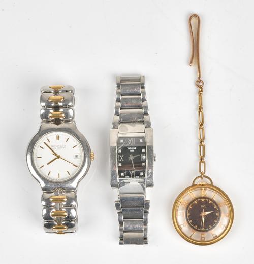 A Tiffany & Co. Tesoro steel and gilt metal gentleman's bracelet wristwatch, the signed white dial with gilt baton numerals, centre seconds and with...