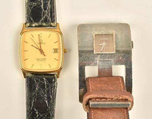 An Omega Seamaster Quartz gilt metal fronted and steel backed curved square cased gentleman's wristwatch, the signed gilt dial with gilt hands,...