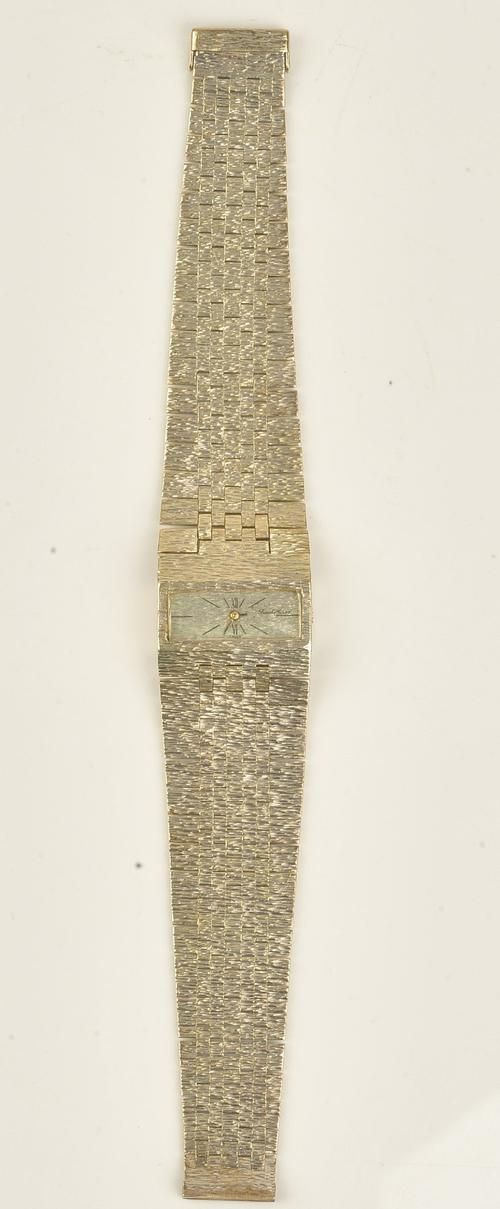 A Bueche-Girod 9ct white gold ladies bracelet wristwatch, the signed rectangular bark textured dial with black Roman and baton numerals, on a...