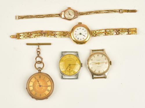 A 9ct gold circular cased ladies wristwatch, the jewelled movement detailed Swiss made, Birmingham 1917, on a sprung bar link bracelet, a plated key...