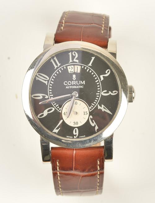 A Corum Automatic steel circular cased gentleman's wristwatch, the signed black dial with silvered Arabic numerals, date aperture and with subsidiary...