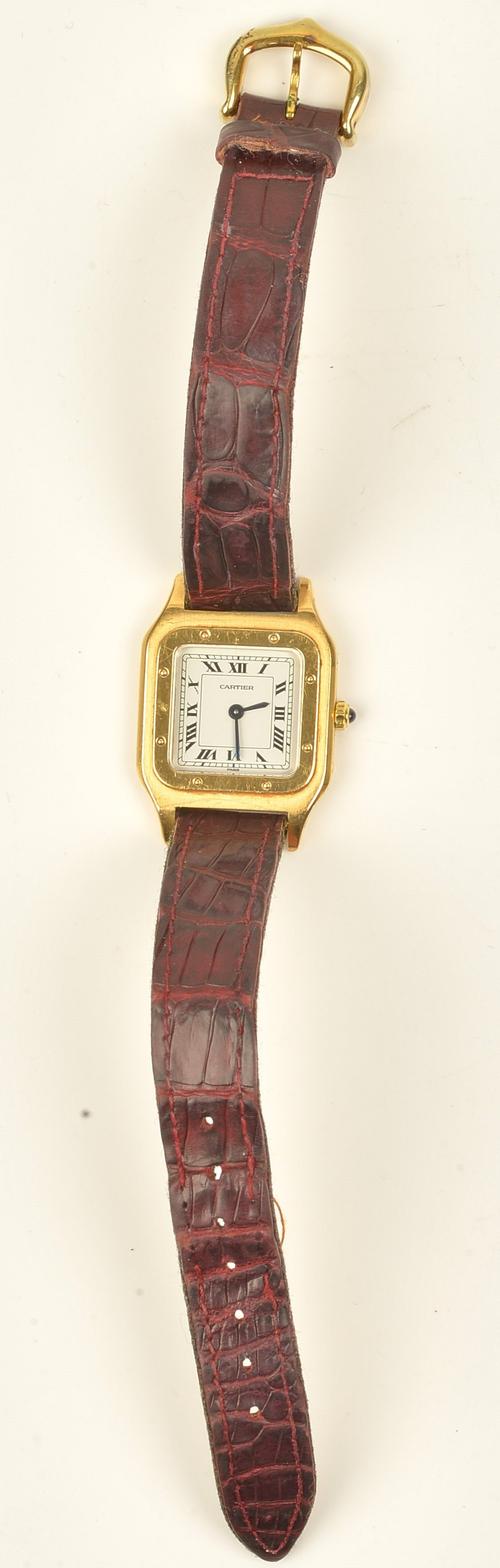 A Cartier Santos 18ct gold cased ladies wristwatch, the signed square white dial with black Roman numerals and with blued steel hands, the signed...