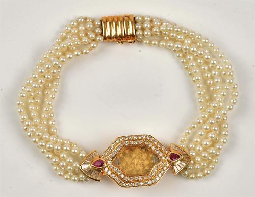 A Jaeger-Le Coultre gold, diamond and ruby set lady's wristwatch case, mounted with circular cut and baguette diamonds and with two pear shaped...