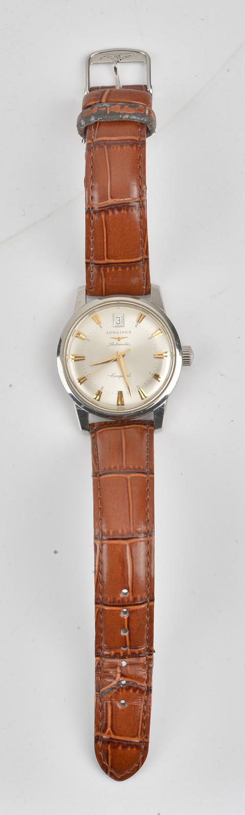 A Longines Conquest Automatic steel cased gentleman's wristwatch, the signed silvered dial with gilt tapered baton hour markers, date of the month...