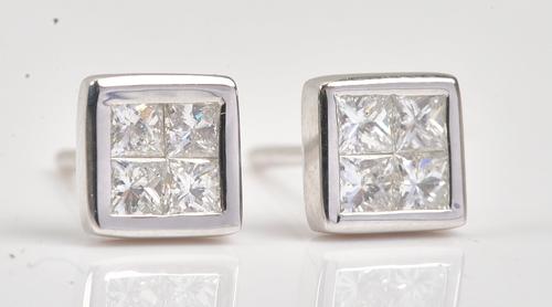 A pair of white gold and diamond earstuds, each mounted with four princess cut diamonds, in a square design, detailed 750 18 K, the backs with post...