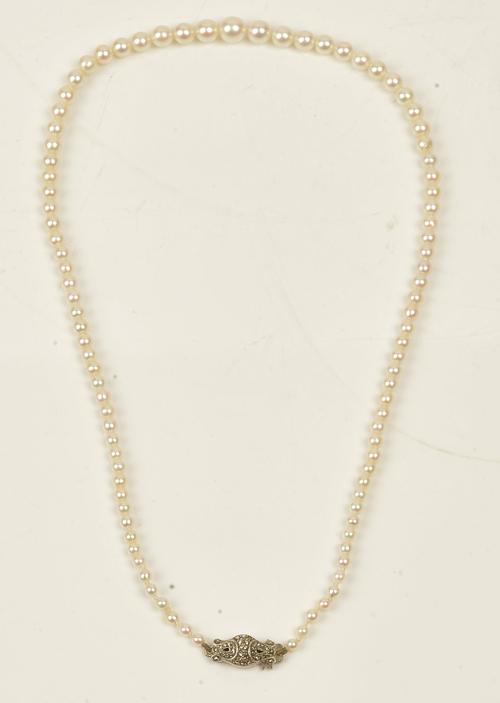 A single row necklace of graduated cultured pearls on a marcasite set clasp, length of necklace, including clasp, 45cm, with a case.