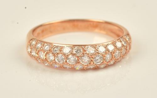 A gold and diamond set half hoop eternity ring, mounted with three rows of circular cut diamonds, detailed 750 18 K, ring size N and a half, gross...