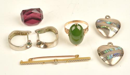 A gold ring, claw set with an oval cabochon nephrite, between decorated shoulders, ring size P, gross weight 3.9 gms, a gold bar brooch, collet set...