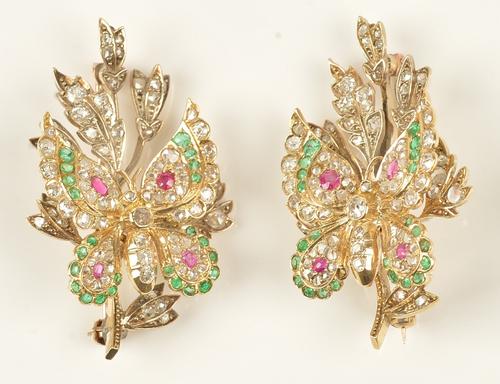 A pair of gold, emerald, ruby and diamond brooches, designed as butterflies and sprays, mounted with variously cut gemstones, length of each 4cm,...