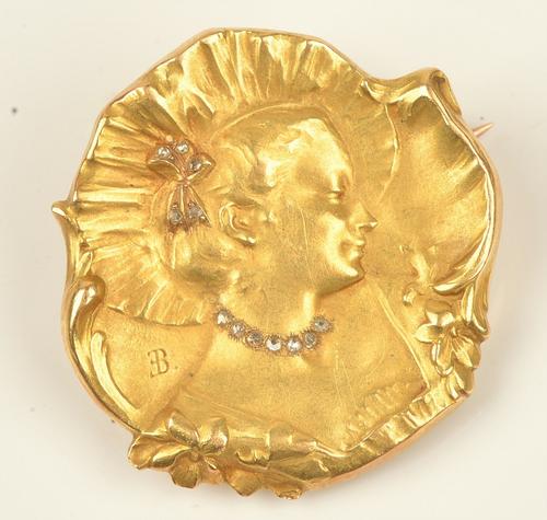 An Art Nouveau gold and diamond brooch, designed as the portrait of a lady wearing a hat with a bow, mounted with rose cut diamonds to her necklace...