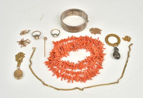 A group of jewellery, comprising; a long single row necklace of branch coral, a seed pearl set stick pin with a case, two rings, a baby's silver...
