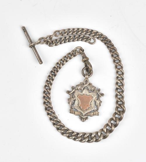 A gentleman's silver graduated curb link watch Albert chain, fitted with a silver T bar, a silver swivel and with a silver fob medallion, Birmingham...