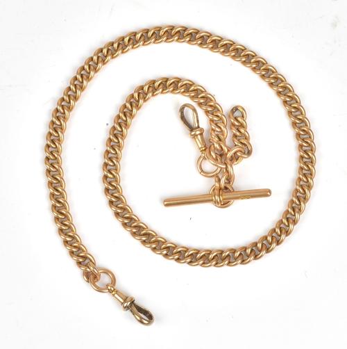An 18ct gold curb link watch Albert chain, fitted with an 18ct gold T-bar and with two 18ct gold swivels, weight 76 gms.