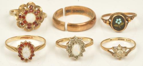 An oval pietra dura ring with a forget-me-not motif, a 9ct gold opal and garnet set cluster ring, (one garnet lacking), a 9ct gold opal and...