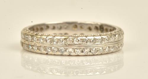 A diamond set full eternity ring mounted with two rows of circular cut diamonds, ring size U, gross weight 5.5 gms.