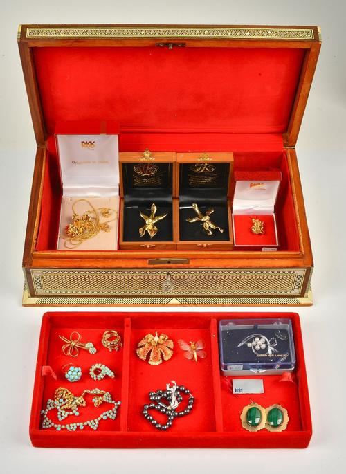 A collection of mostly costume jewellery, including; a selection of gilt metal orchid jewellery with cases, five items of pale blue paste set...