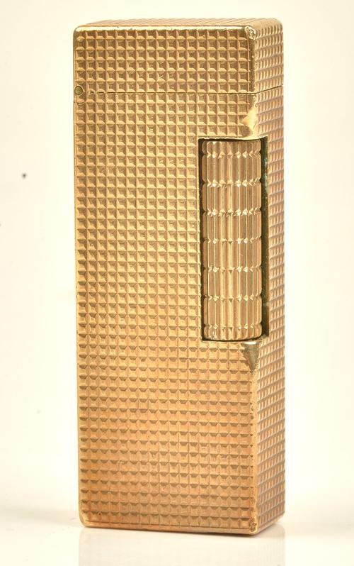 A Dunhill 9ct gold, rectangular cased gas lighter, the exterior engine turned, detailed Dunhill London, London 1964, height 6.5cm, gross weight...