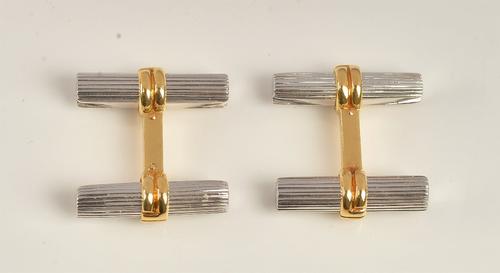 A Boucheron pair of French two colour gold cufflinks, each of twin fluted baton form, detailed OR 750 A 084.4999, combined gross weight 16.8gms, with...