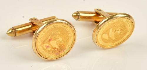 A pair of gold cufflinks, each circular front mounted with a Chinese panda gold coin detailed .999 1/20 OZ Au, the backs with folding sprung bars,...